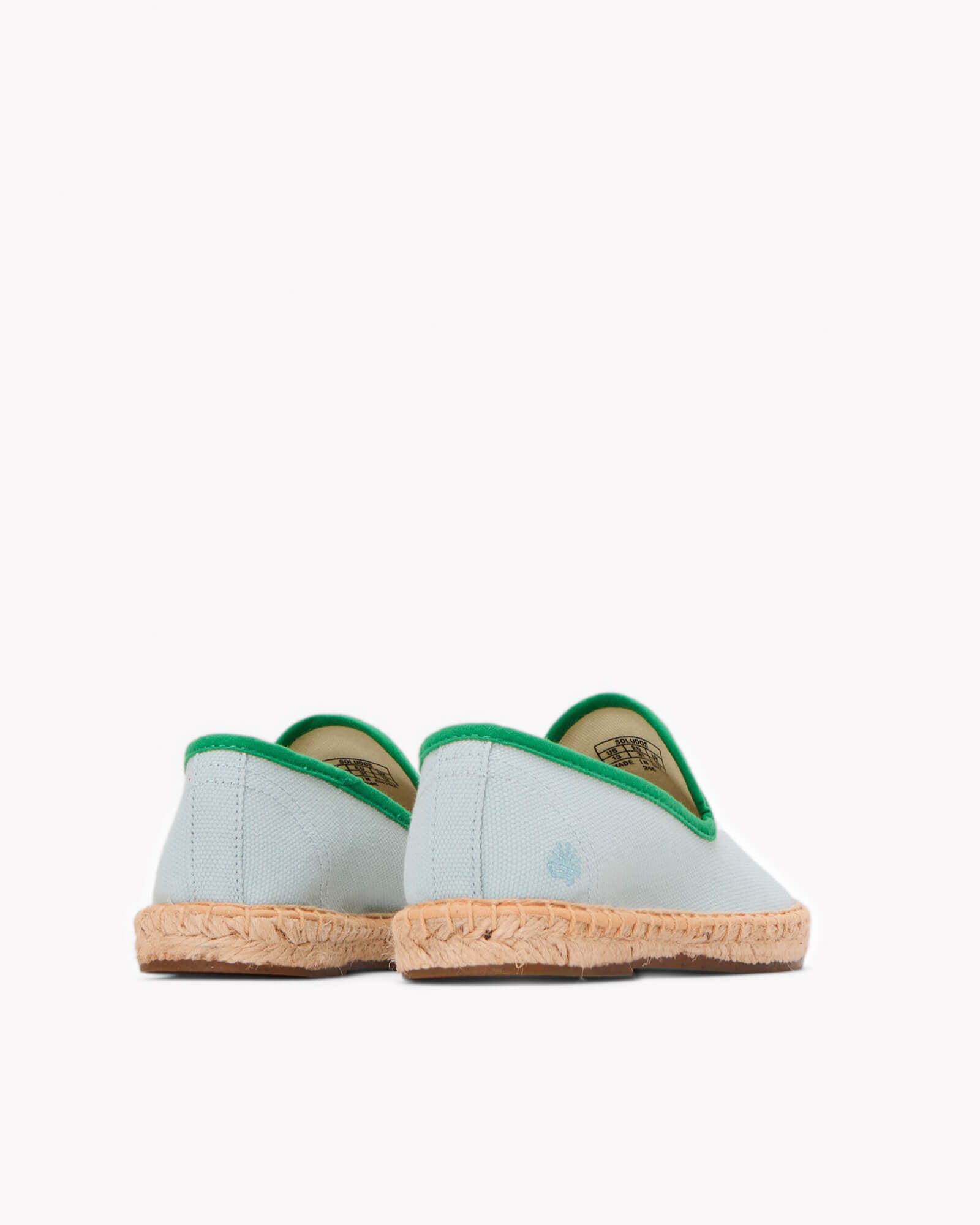 Kids mint espadrille shoes with green piping on gray background