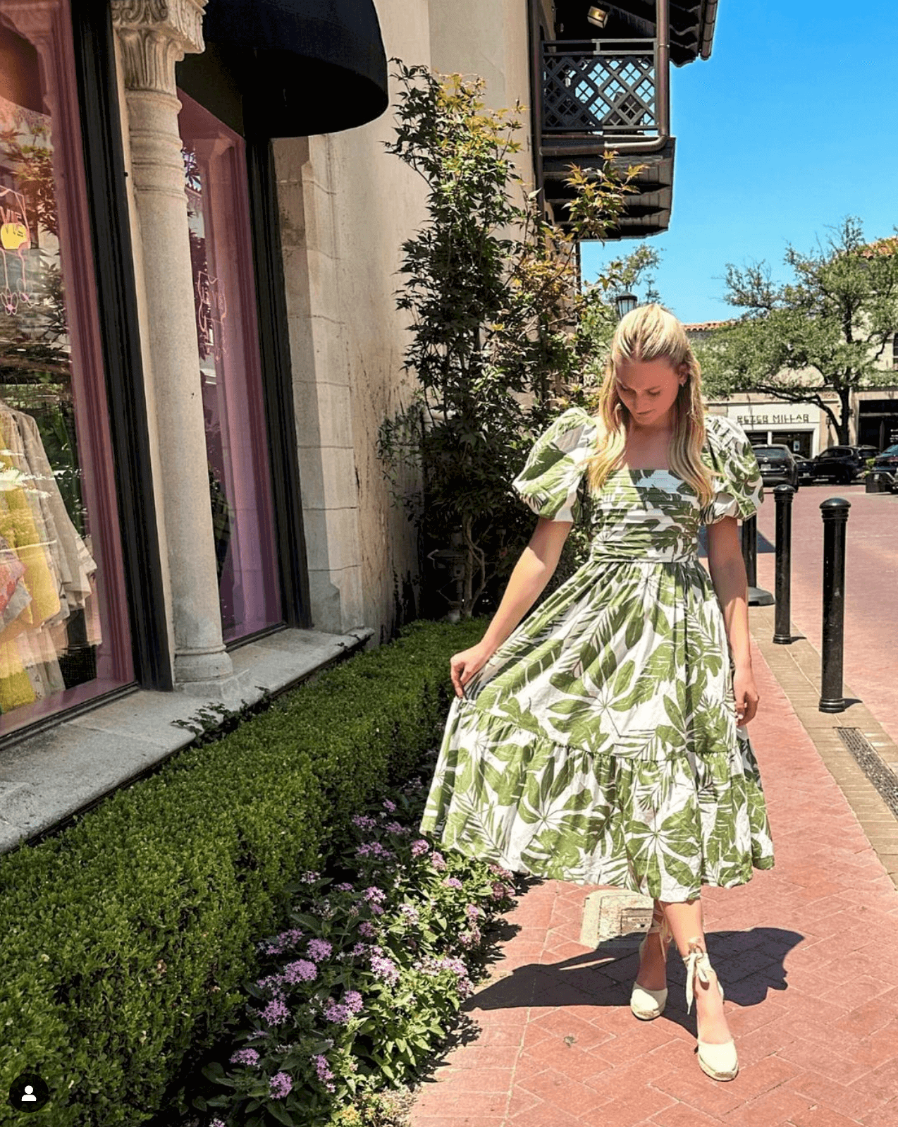 Woman wearing ivory espadrille wedges in a white and green dress in UGC style