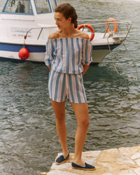 Adult man wearing navy espadrilles with blue piping around it